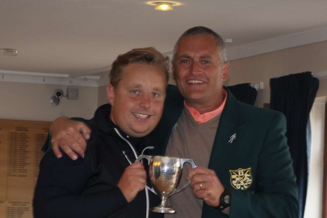 Toby Simmance, left, celebrates his Sheerness Golf Club Championship win with club captain Paul Mosdell Picture: Alex Tindall