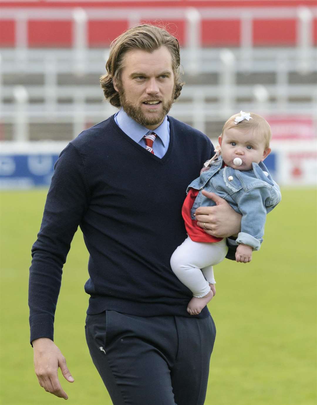 Boss Daryl McMahon thanks the fans for their support with his youngest daughter Picture: Andy Payton