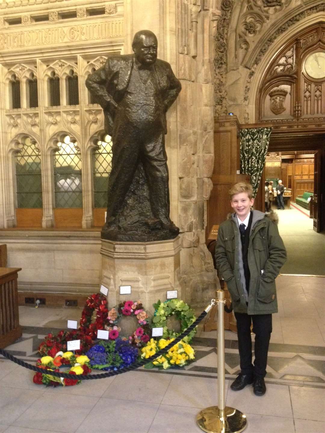 Evan Lewis at Churchill's statue in the House of Commons