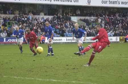 Marlon King nets from the penalty spot to earn Gills a point. Picture: PAUL DENNIS