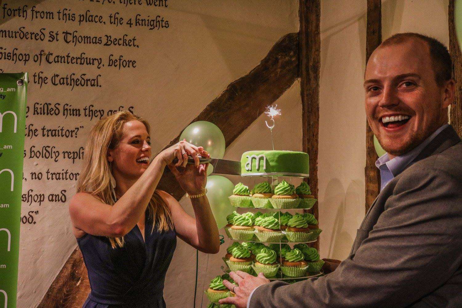 AM Marketing founder Amy McManus cuts the cake on its third birthday last year, watched by husband and business partner Brad