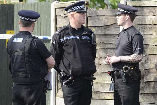 Officers gather in Herne Bay where a man was found ablaze. Picture: Chris Davey