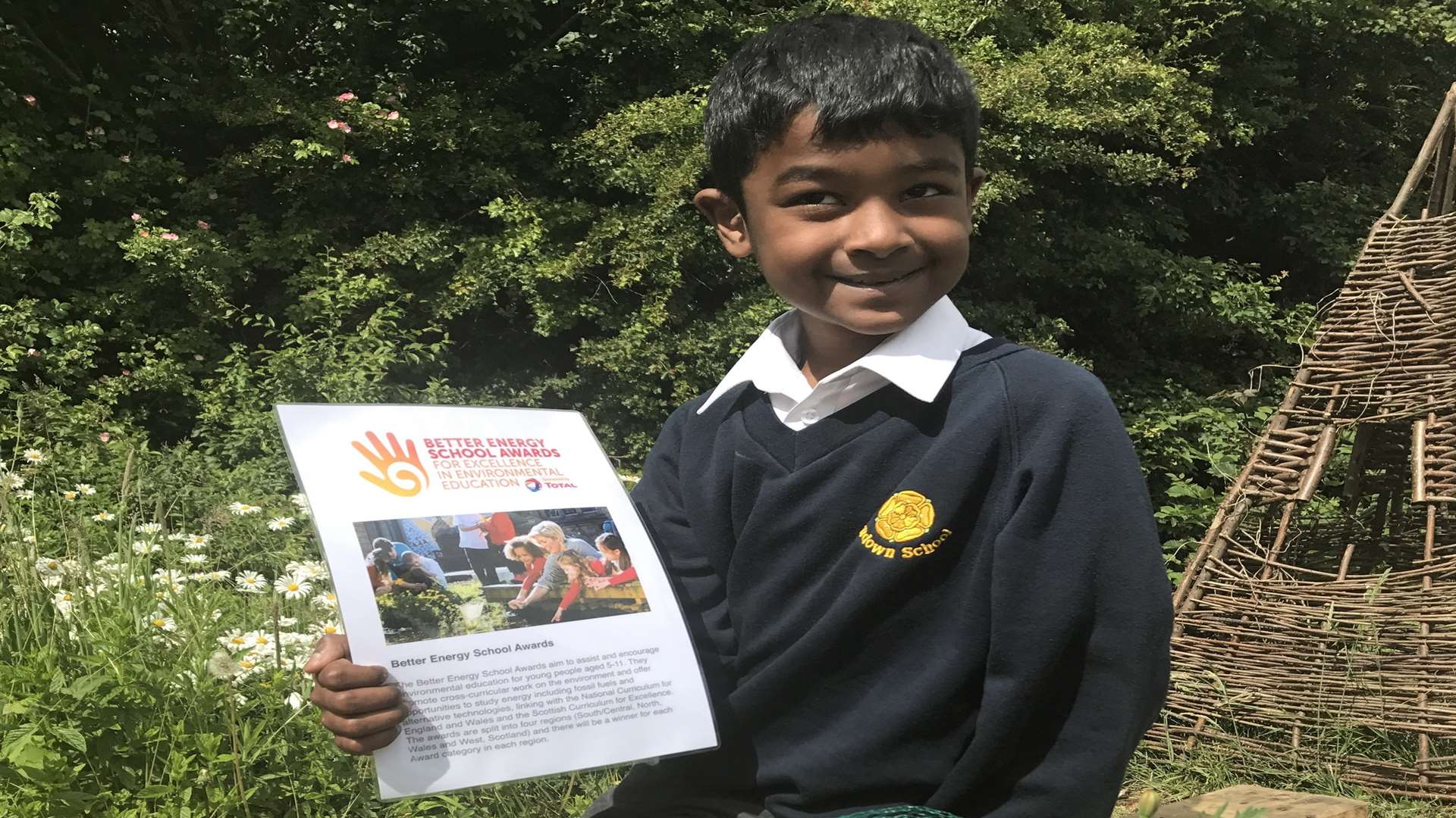 Antony Jayaseelan, eight, with the school's Young Person Trust for the Environment certificate which they received following the bird project