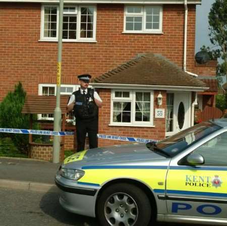 Police at the property where the woman's body was found. Picture: GARY BROWNE