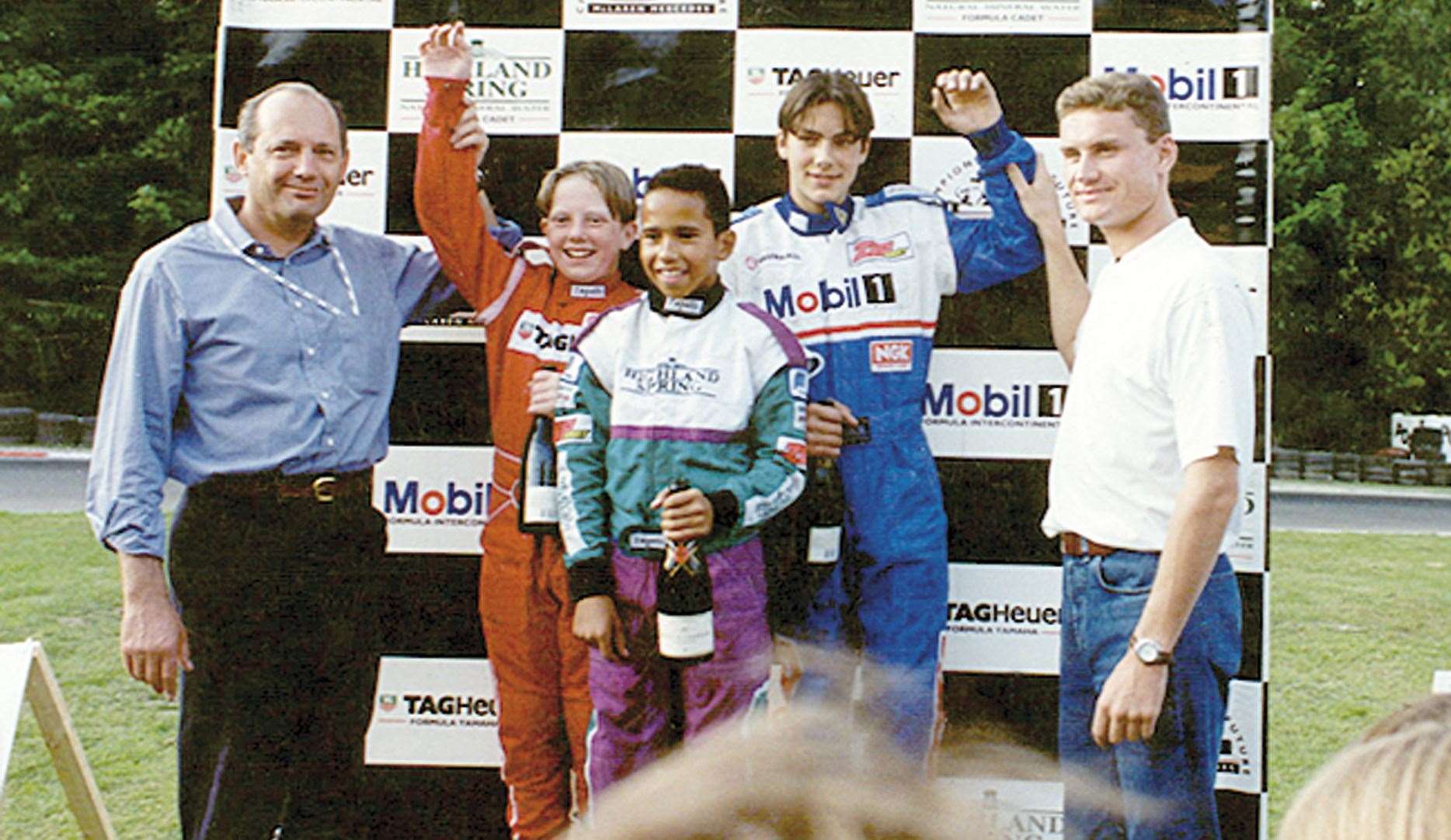 Lewis Hamilton with former McLaren boss Ron Dennis and 13-time Grand Prix winner David Coulthard at Buckmore in September 1996