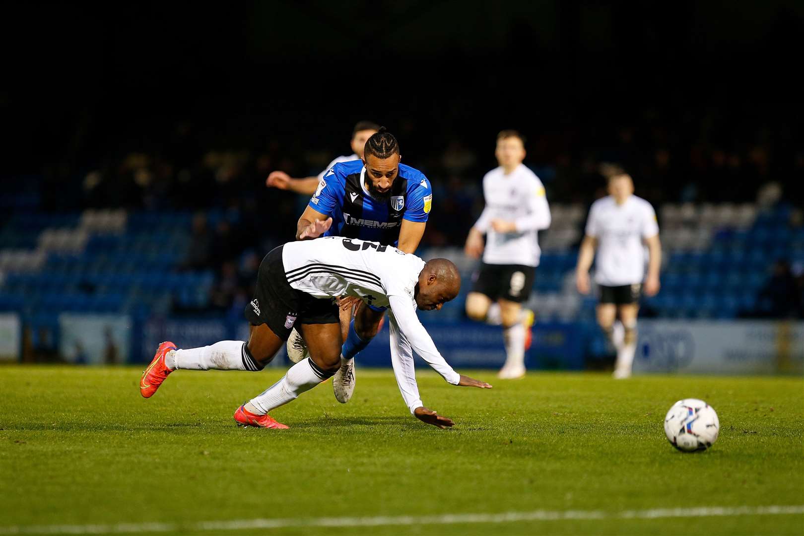 Sone Aluko and Gillingham defender Rhys Bennett compete for the ball Picture: Andy Jones