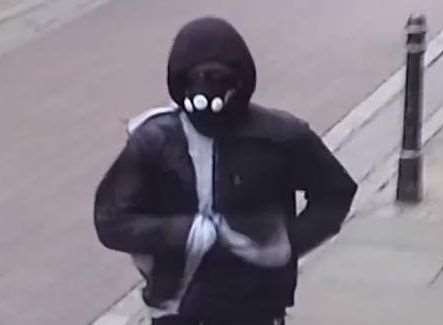 A CCTV image of the robber fleeing the scene in Burgate, Canterbury