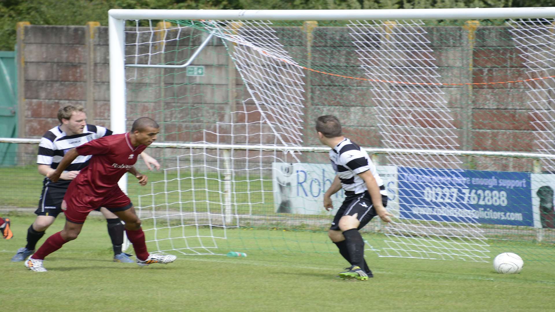 Canterbury City (maroon) in action against Deal
