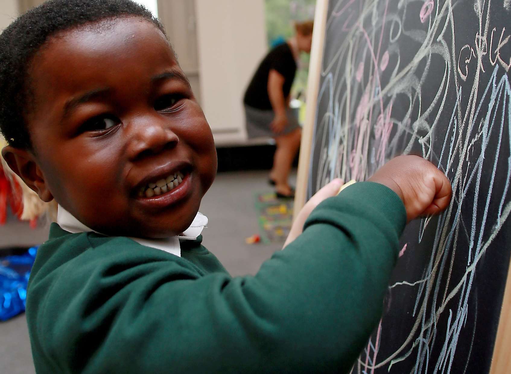 A youngster practises his drawing skills in the nursery room. Picture: Phil Lee