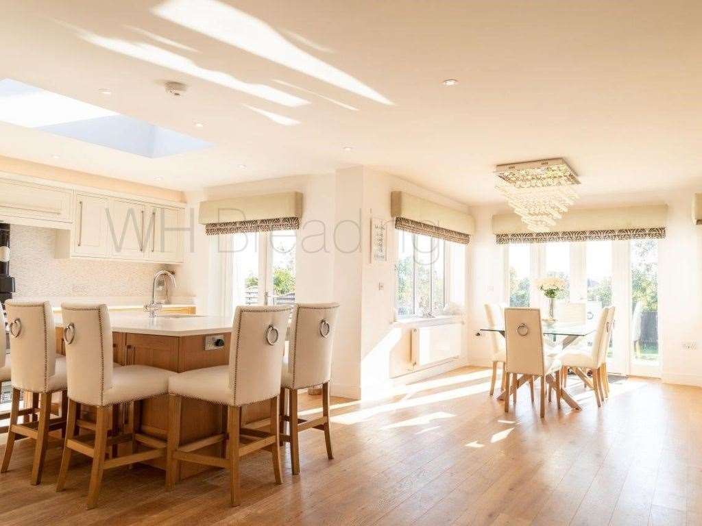 An open concept dining area has hardwood floors and great light. Photo: Zoopla