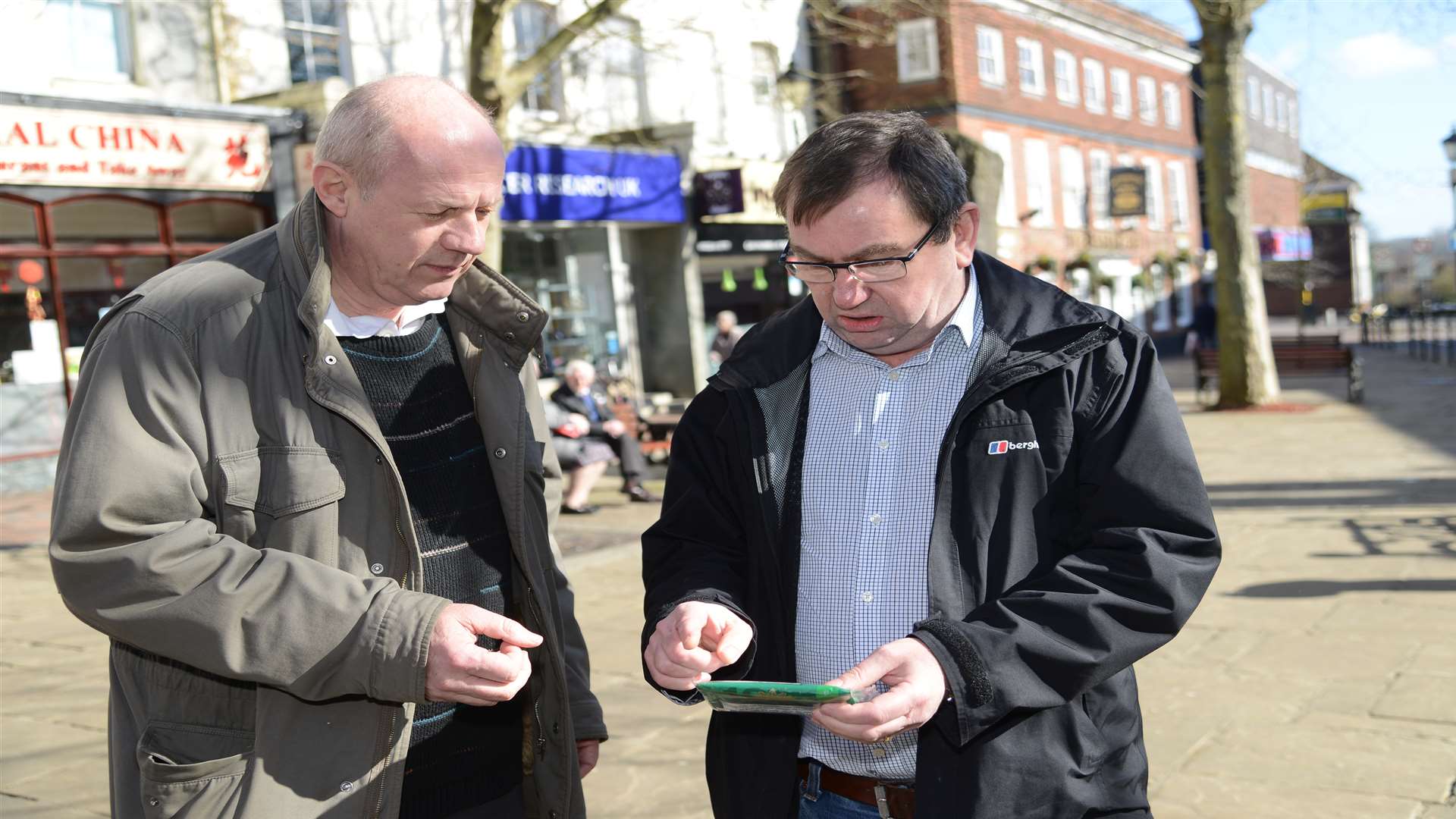 MP Damian Green with Will O'Reilly looking at a recently-purchased packet of illicit rolling tobacco