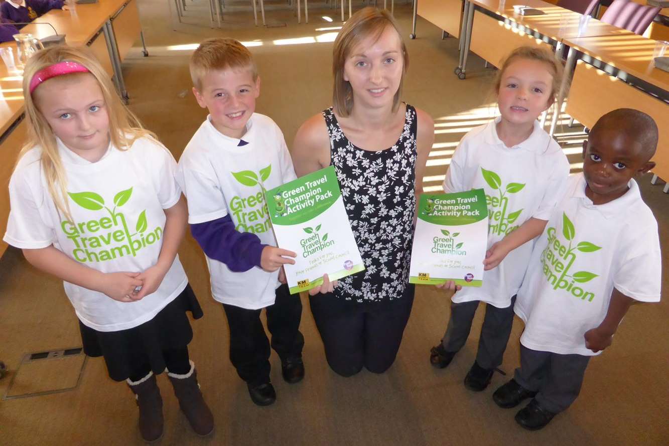 Sarah Revell from Maidstone-based Countrystyle Recycling launches the KM Green Champion event in the council chamber in Maidstone with Jasmine Woodridge, eight, David Smith, seven, Mya Riddell, six, and Kenan Minta, four.