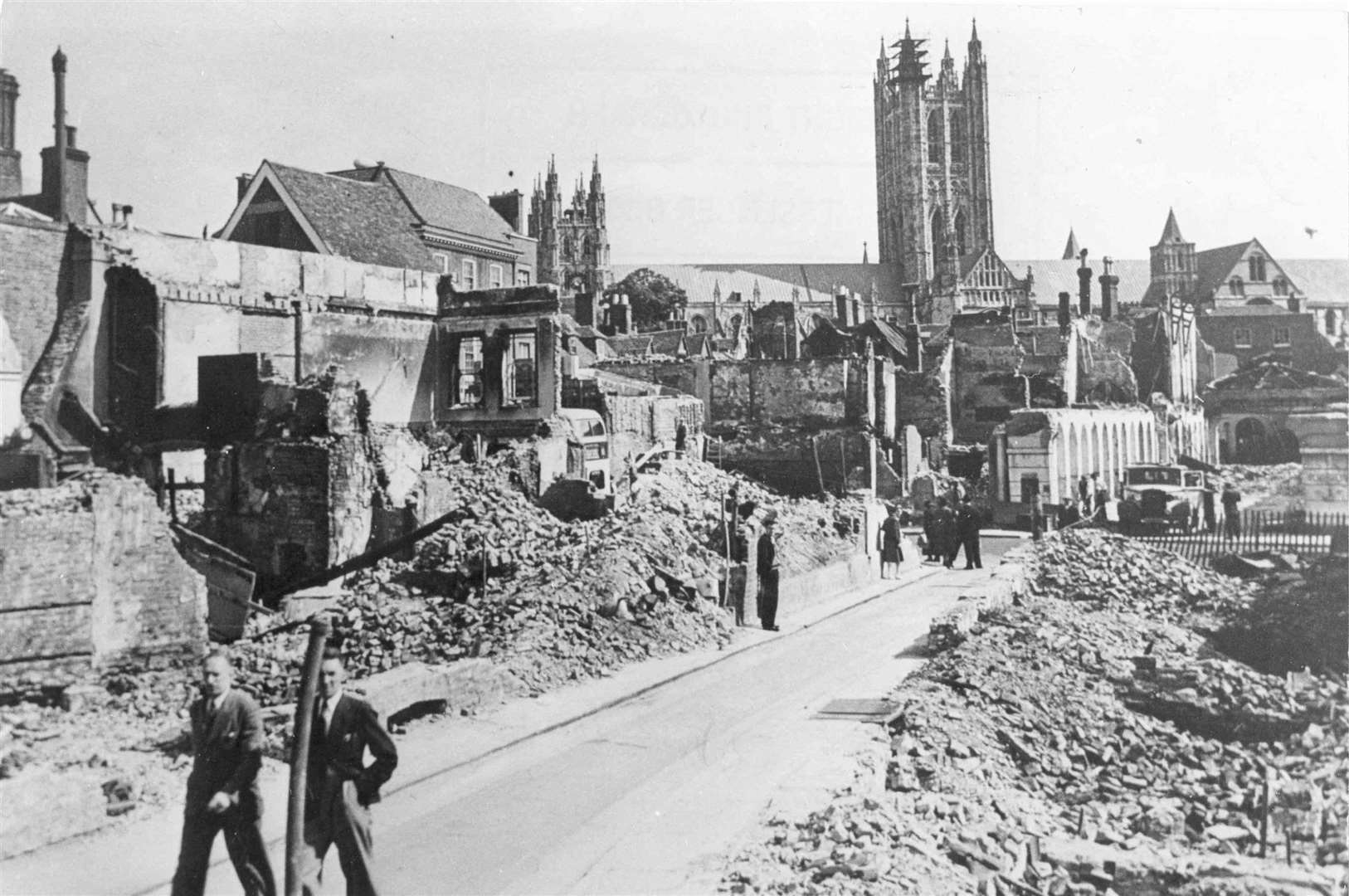 A scene of destruction with Canterbury Cathedral in the background, taken in June 1942