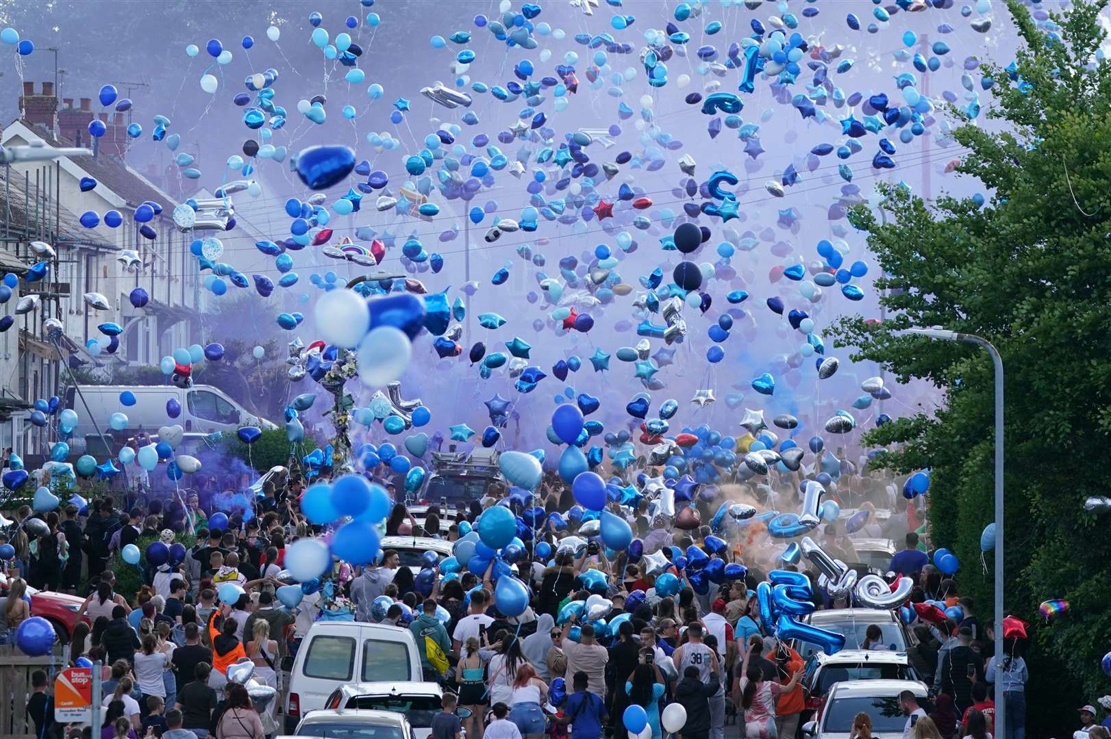 Dozens of blue balloons were released during a vigil for the two teenagers (Jacob King/PA)