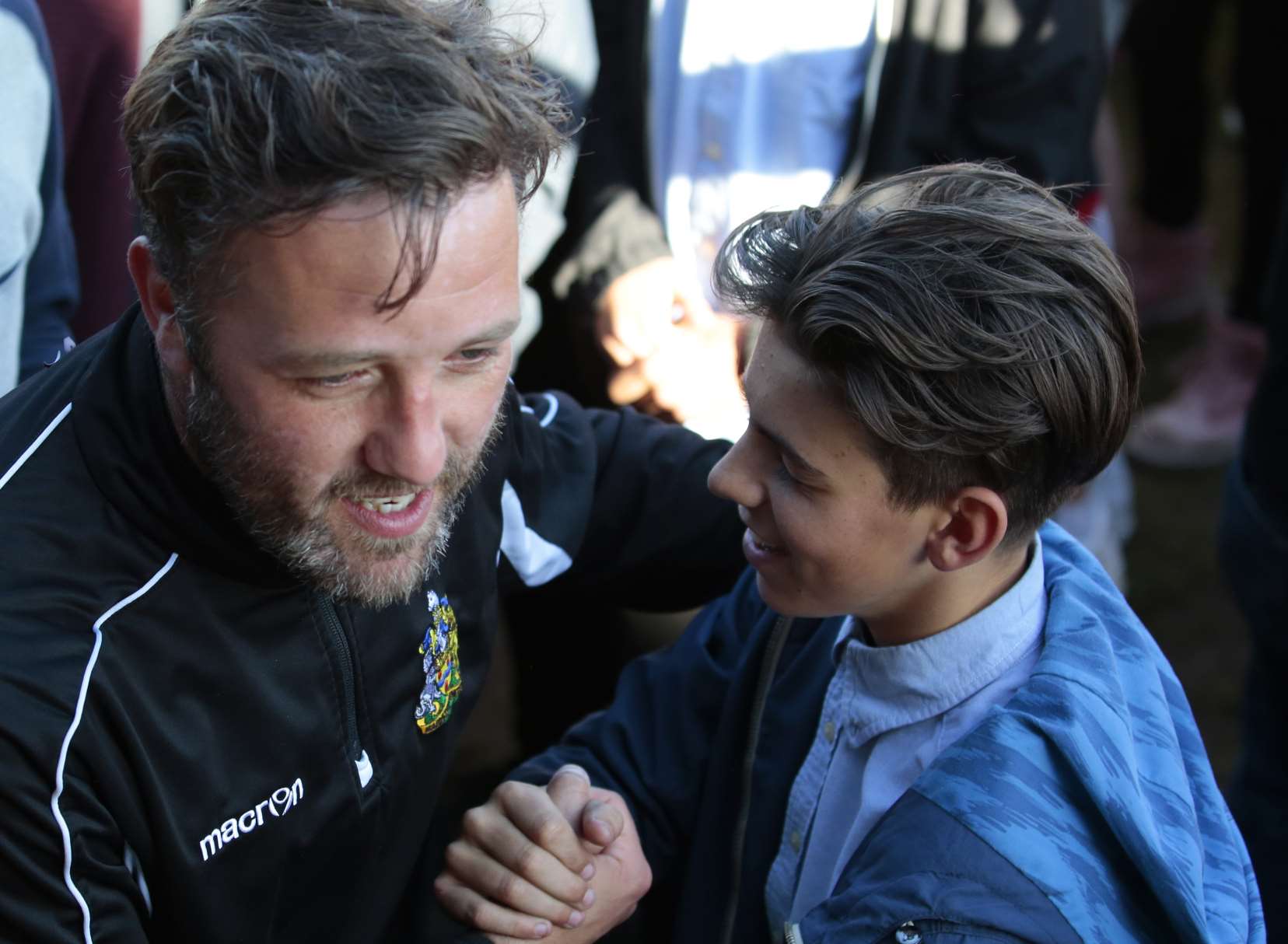 Jay Saunders celebrates with fans after Maidstone clinched the Ryman League championship Picture: Martin Apps