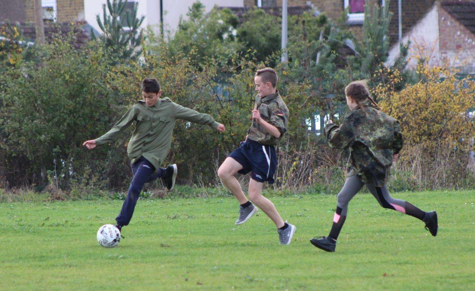 Action on the pitch as students from Sheppey's Oasis Academy recreate the 1914 Christmas Day truce football match in Sheerness (5324680)