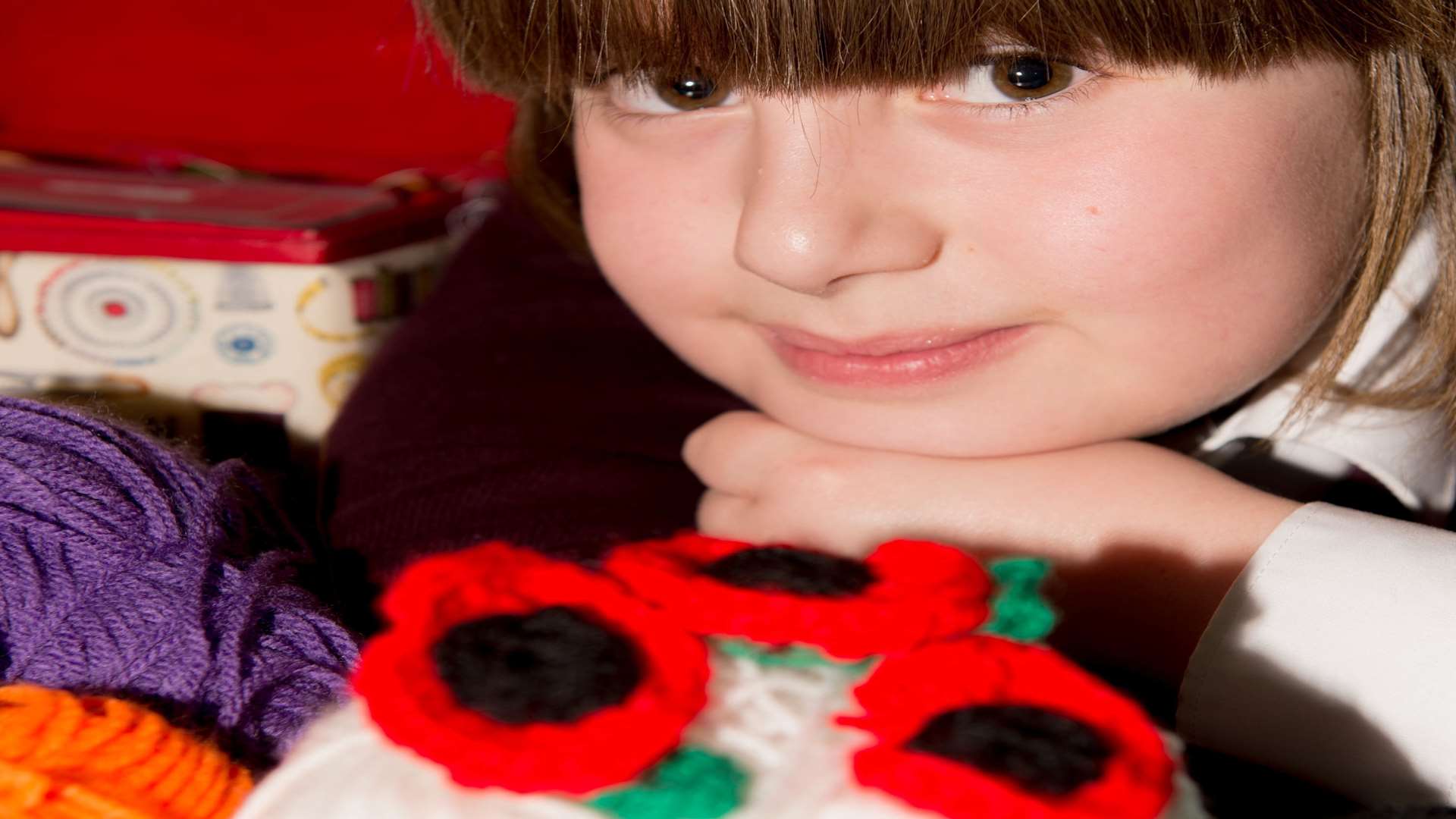 Charlotte-Mae with her poppies