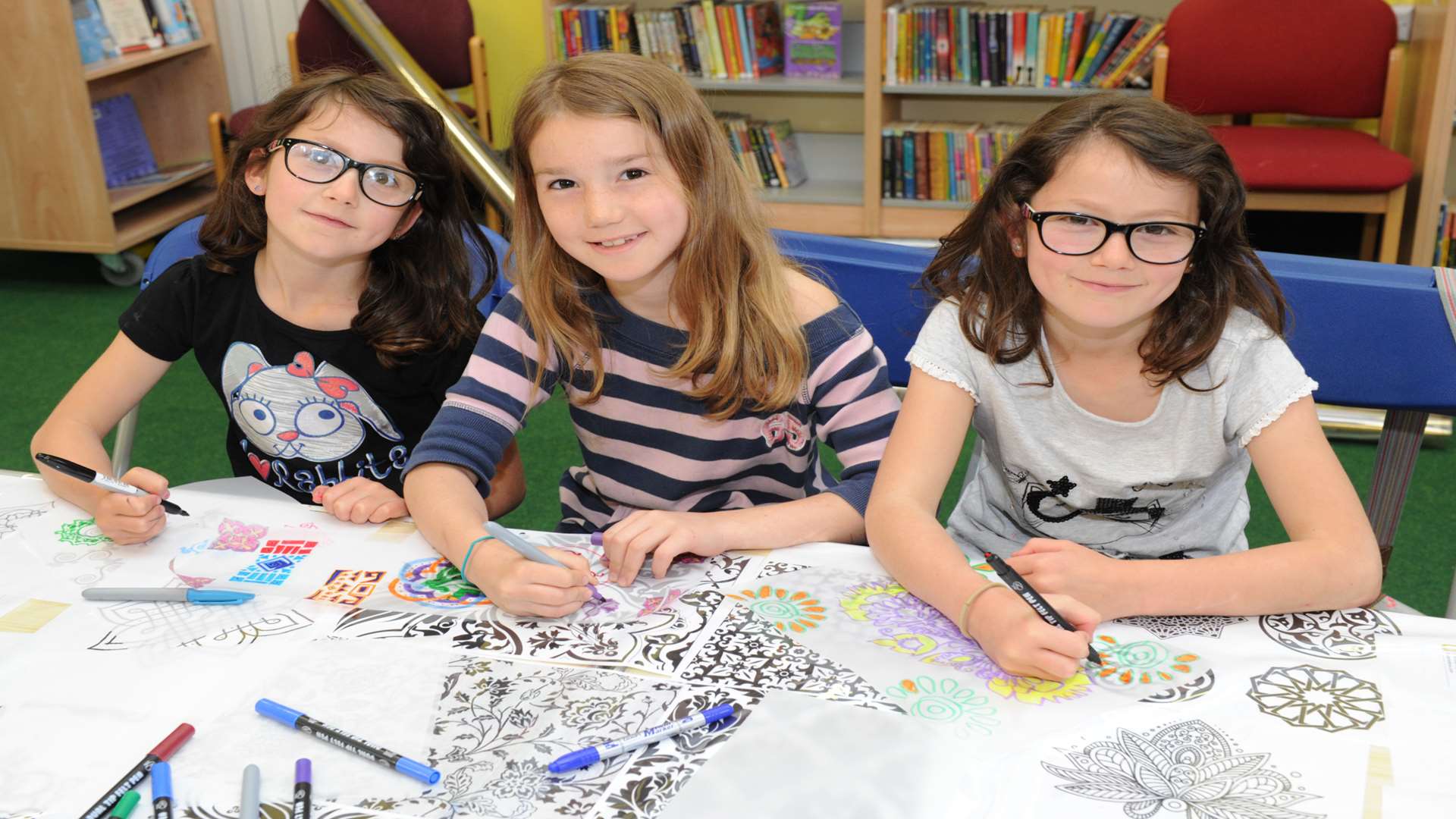 Scarlett, 7, Olivia, 9, and Erin, 7, creating art work to decorate Gillingham High Street this year.