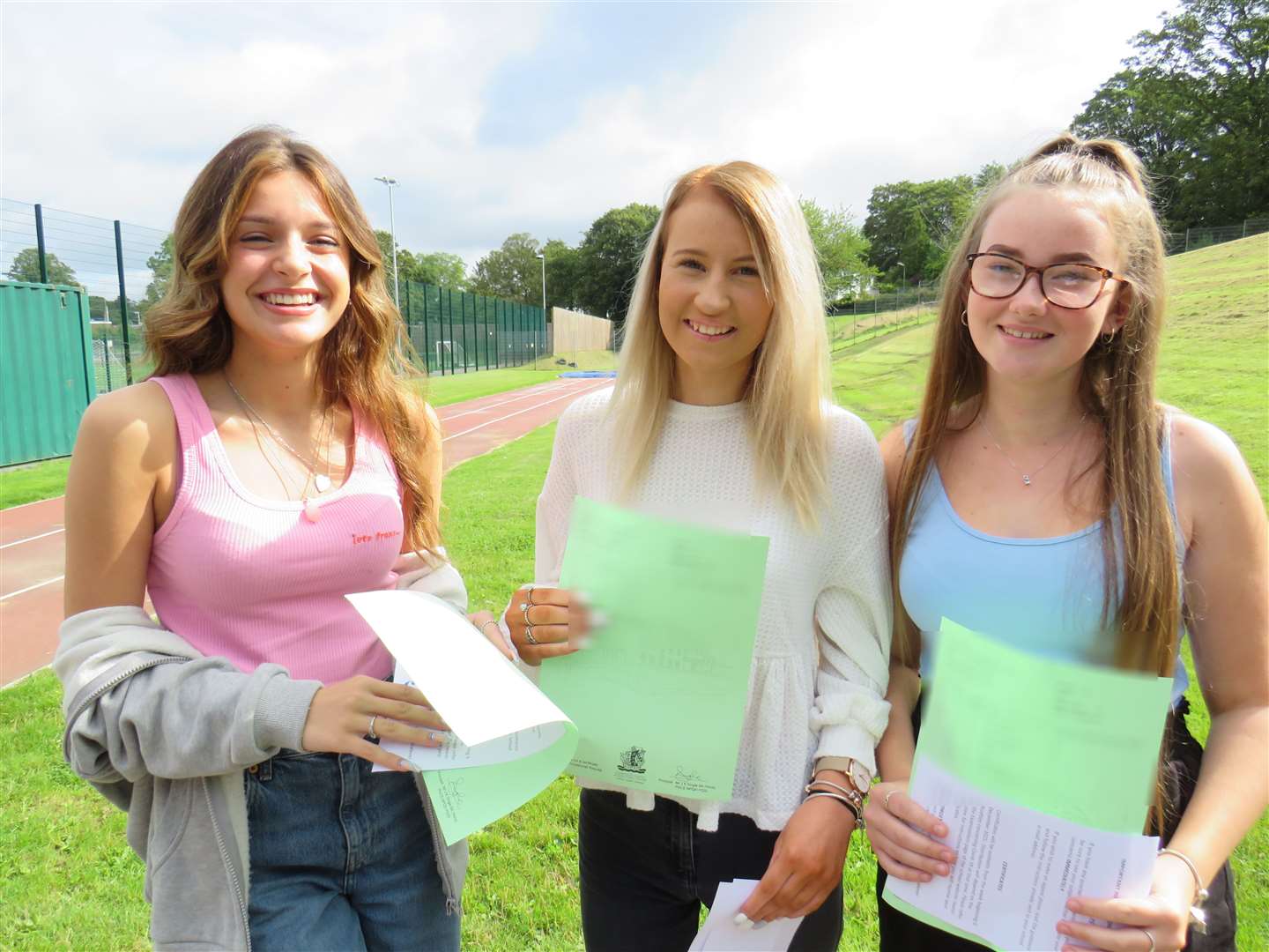 Homewood School's Alesha, Nikita and Lily-Mae with their results