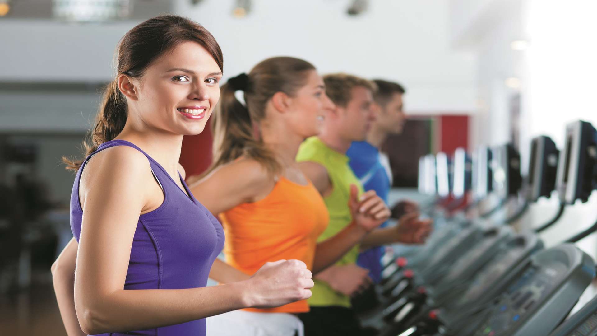 People in a gym on treadmill. Stock image