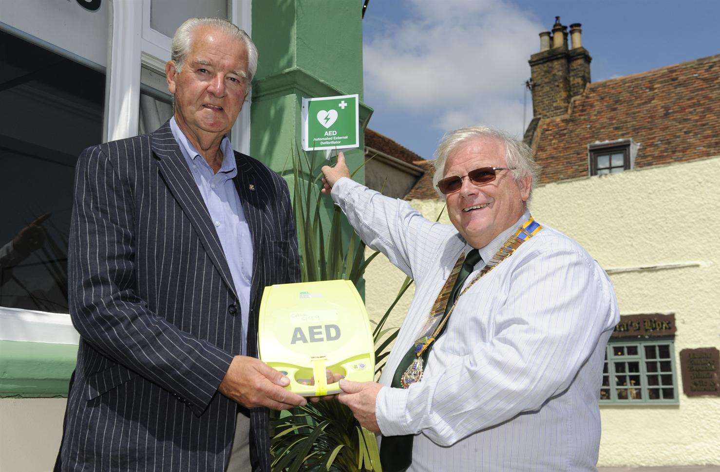 John Utting and Ian Dunkerley with the defibrillator.