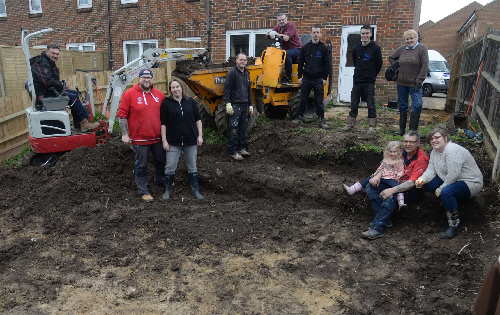 Parents Matthew and Emma Powell with the team from BW Plant Hire, the RJB Group, Tomas Support Group and Robert Brock and Sons skip hire involved in the garden makeover for Tomas Powell. Picture: Chris Davey (31502622)
