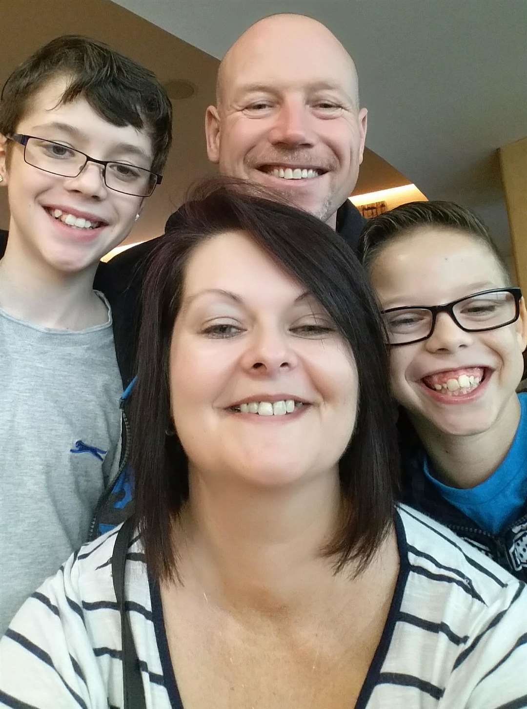 From left: Ting with his mum Ann, dad Neil and brother Ben