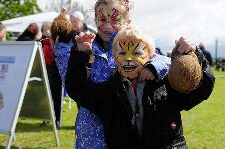 Molly Turner, aged six, with her brother Zachary, three, showing off their winnings from the coconut shy at Whitstable's May Day celebrations on Tankerton Slopes.