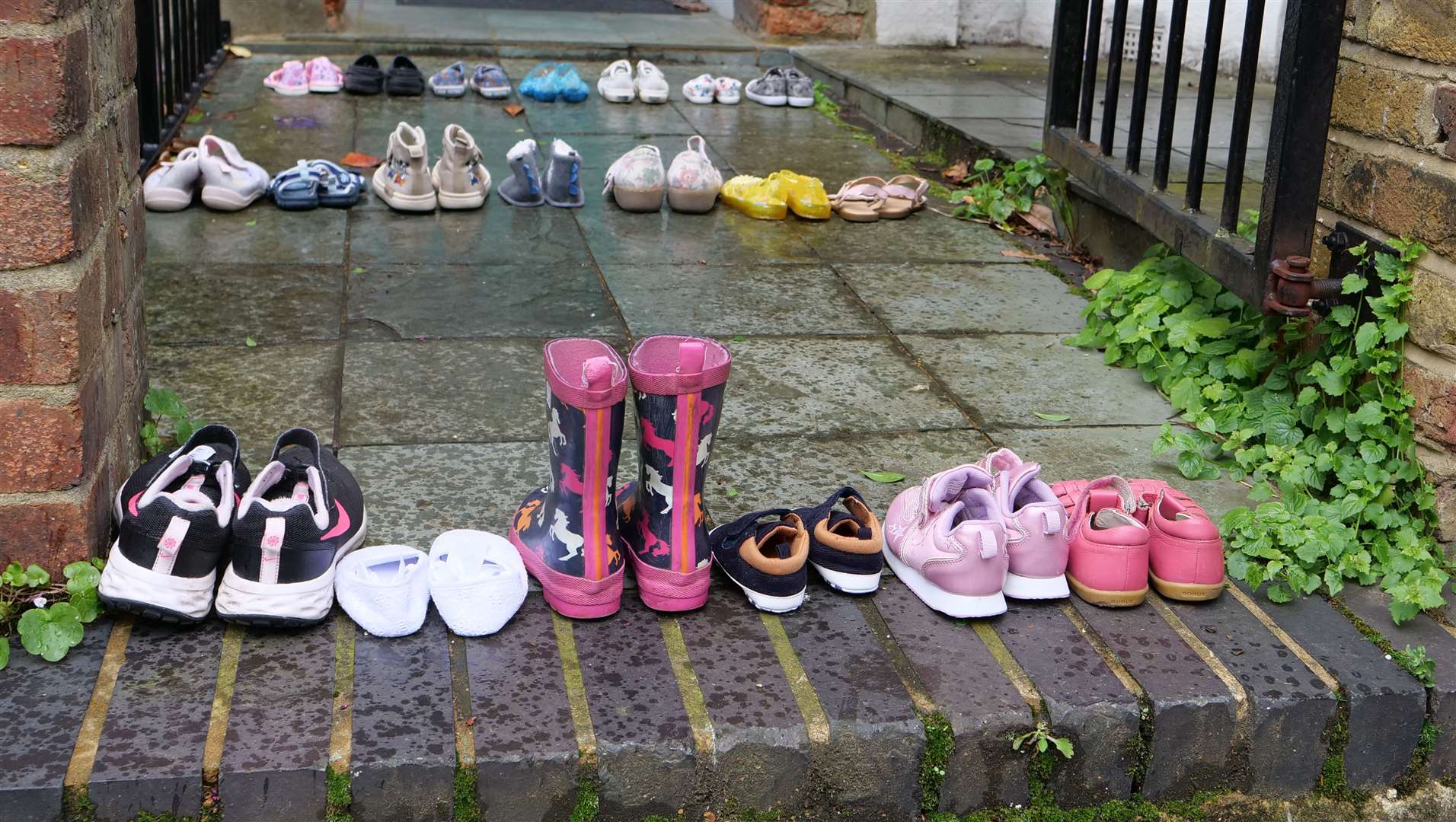 Protesters laid rows of children’s shoes in front of the Labour leader’s door to signify children killed in Gaza (Youth Demand/PA)