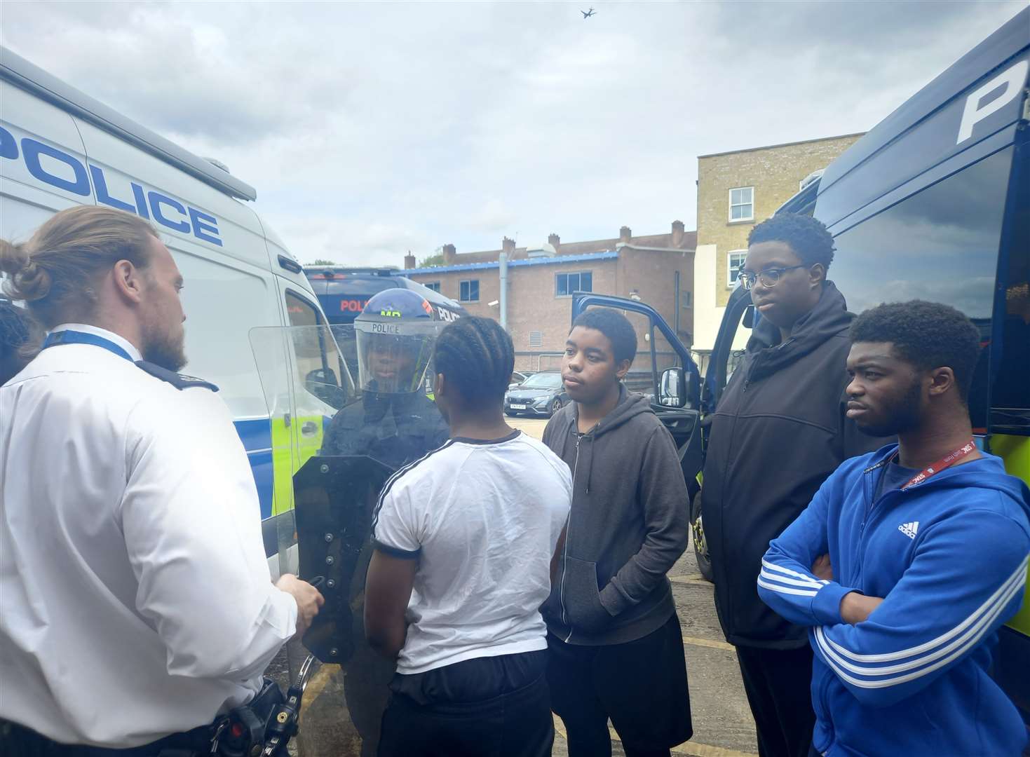 Elevated Aspirations pupils trying on the public order kit in the backyard. Picture: Met Police