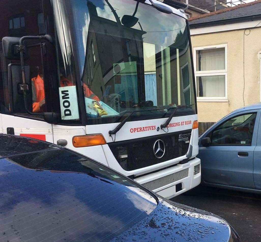 A refuse vehicle has trouble getting through because of parked cars Picture: MBC