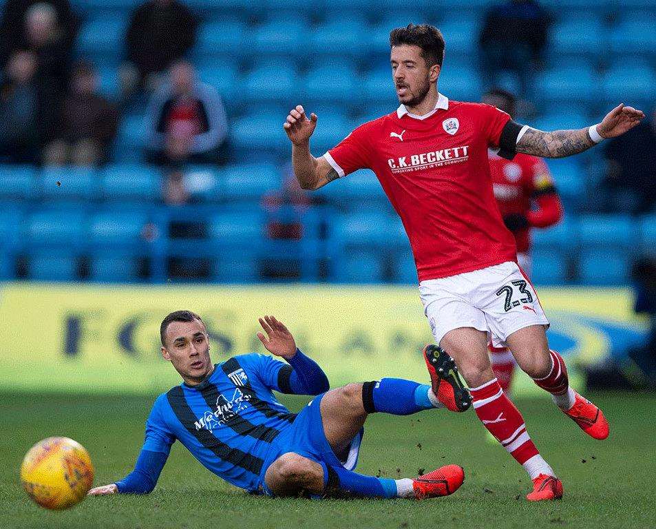 Dani Pinillos gets away from Gillingham's Graham Burke Picture: Ady Kerry