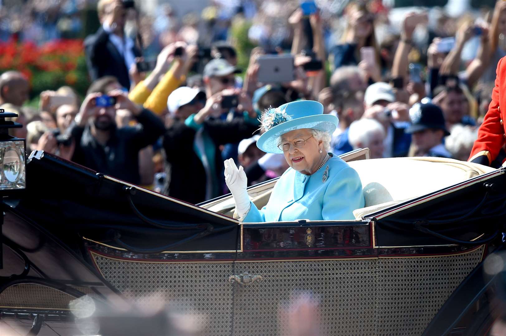 The Queen waving to the crowds on her way to the parade ground in 2018 (Pete Summers/PA)