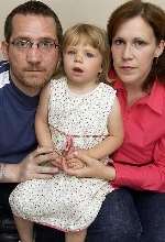 Toddler Abbi Fowler with parents Stephen and Lorna. Picture: GERRY WHITTAKER