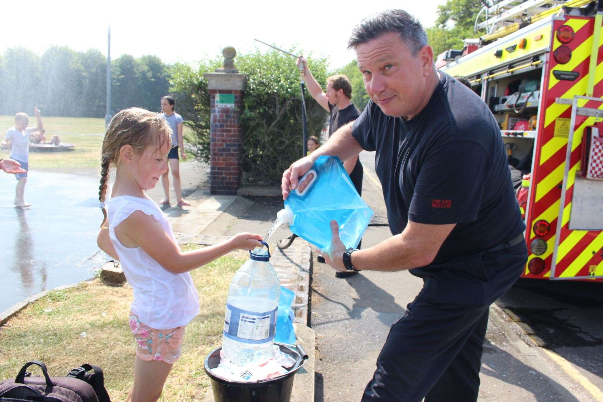 Iced water was given out to youngsters by Sheppey firefighter Andy Friday at Beachfields Park, Sheerness, on Thursday. Picture John Nurden (14293402)