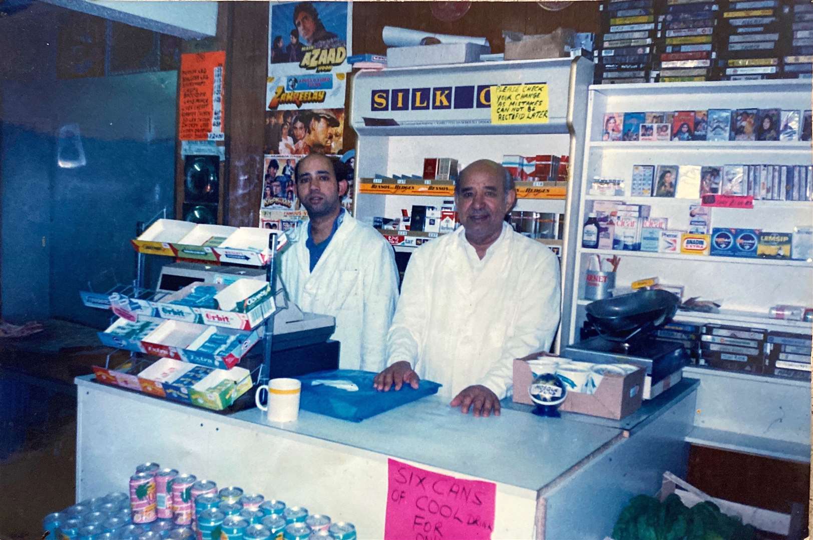 Father Hakim and his son Altaf man the store
