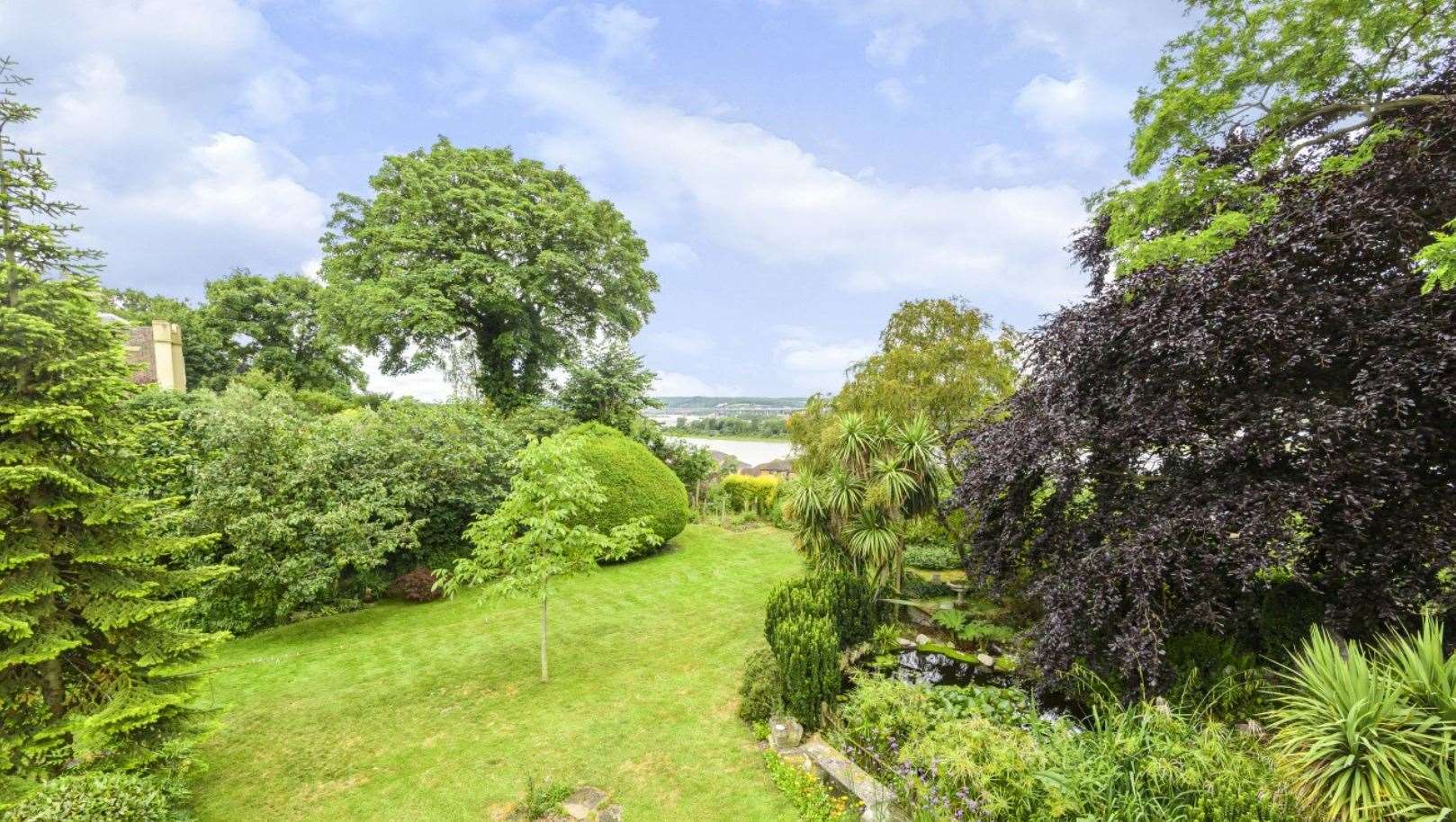 The garden has truly remarkable views over the river. Picture: Fine and Country