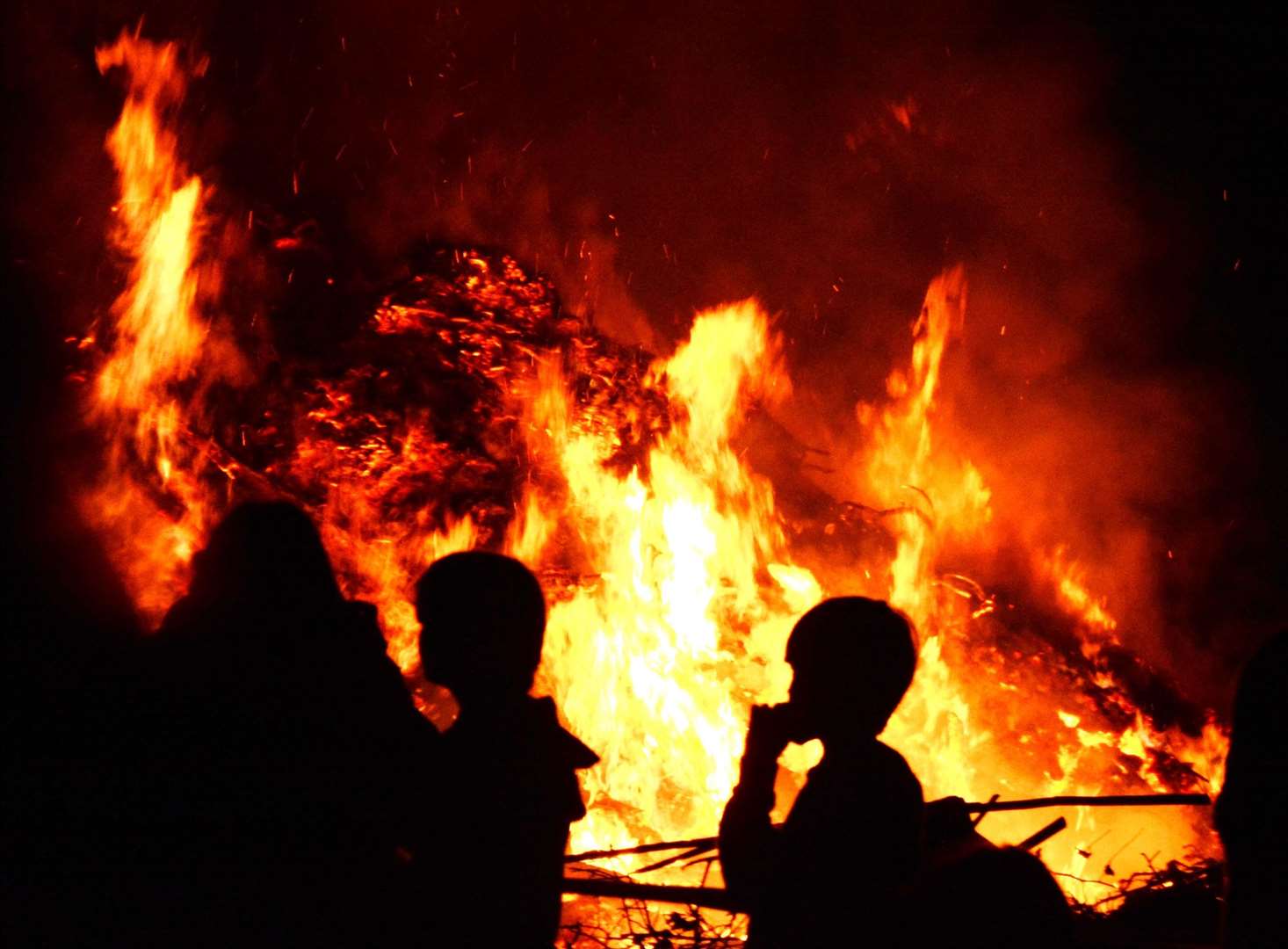 Watch fireworks light up the sky while huddled around a bonfire