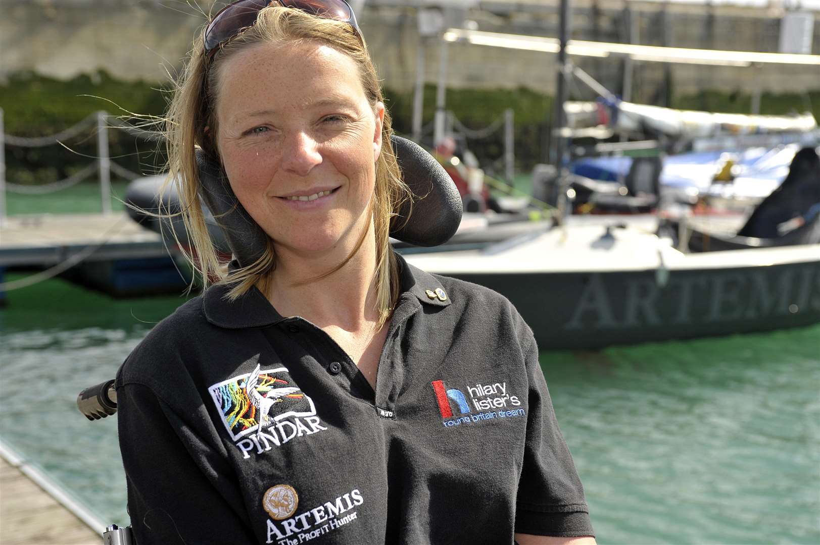 Hilary Lister at Dover harbour with her boat, after completing her record-breaking round-Britain voyage