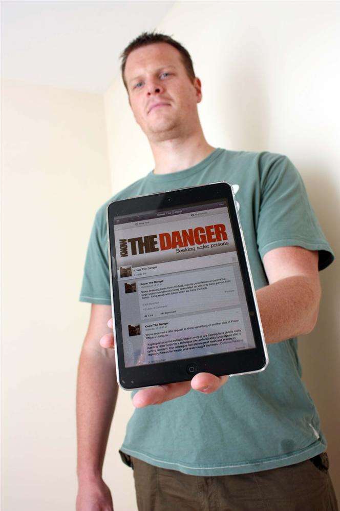 Michael Rolfe shows the Know The Danger Facebook page for prison officers