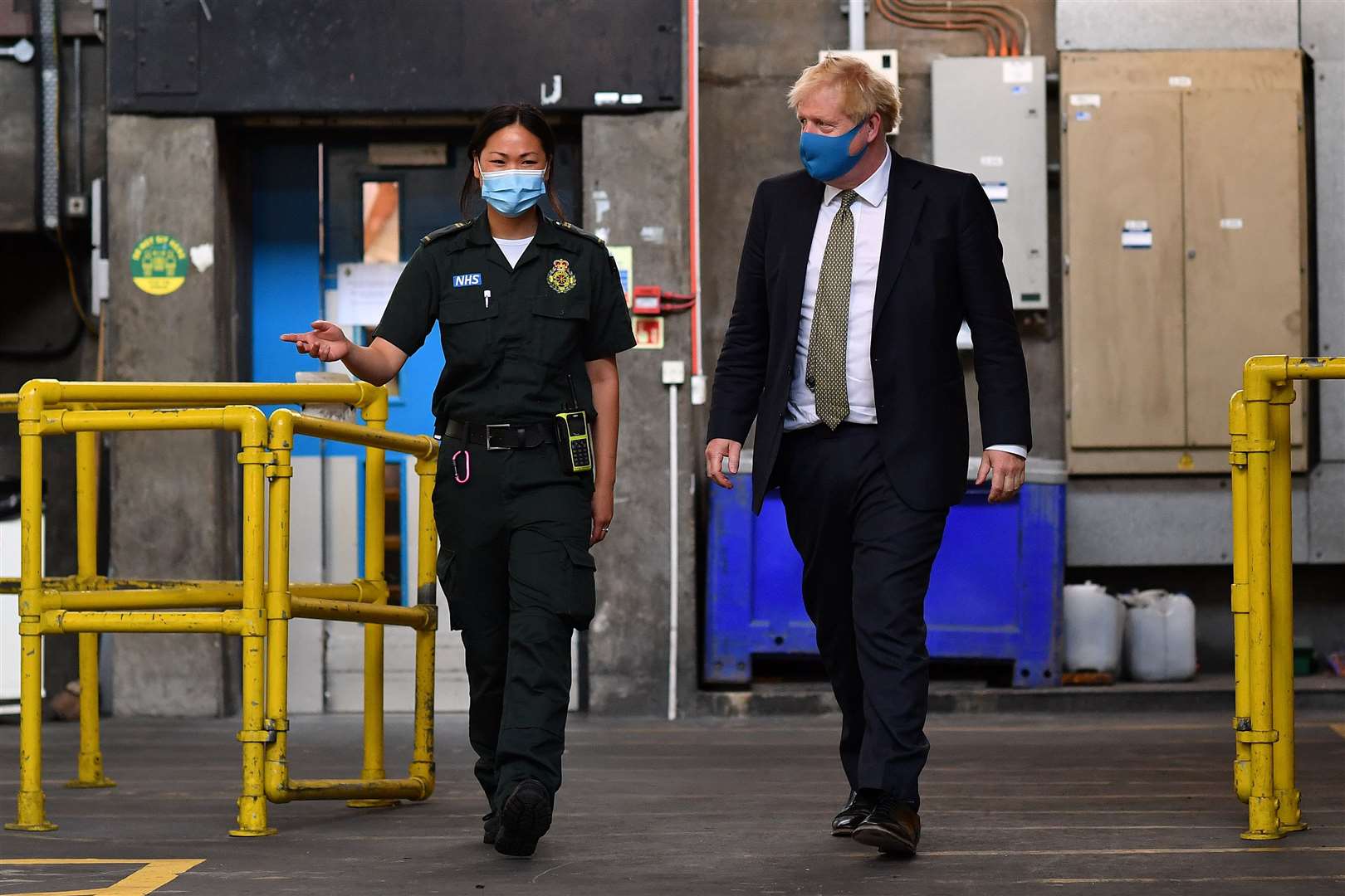 Prime Minister Boris Johnson talks with paramedic Cindy Fu during a visit to the headquarters of the London Ambulance Service NHS Trust (Ben Stansall/PA)