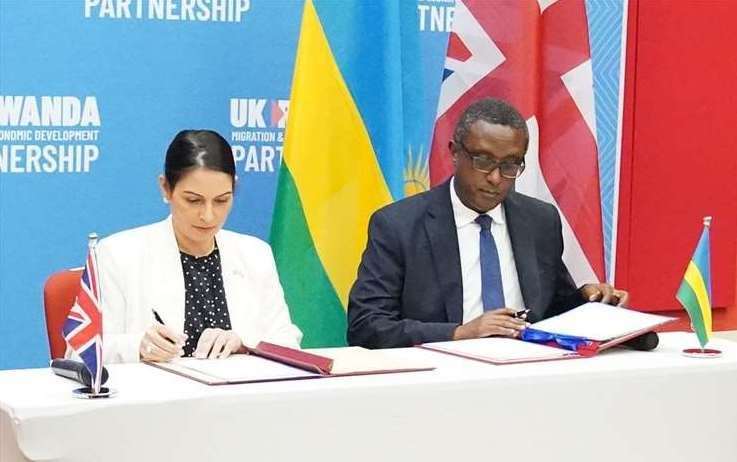 Home Secretary Priti Patel and Rwandan Foreign Minister Vincent Biruta sign the migration and economic development partnership in Kigali in April. Picture: Flora Thompson/PA