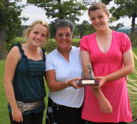 Sophie Daws, right, receives the Milstede Trophy from founder Iris Smith. Watching is runner-up Carol Jones