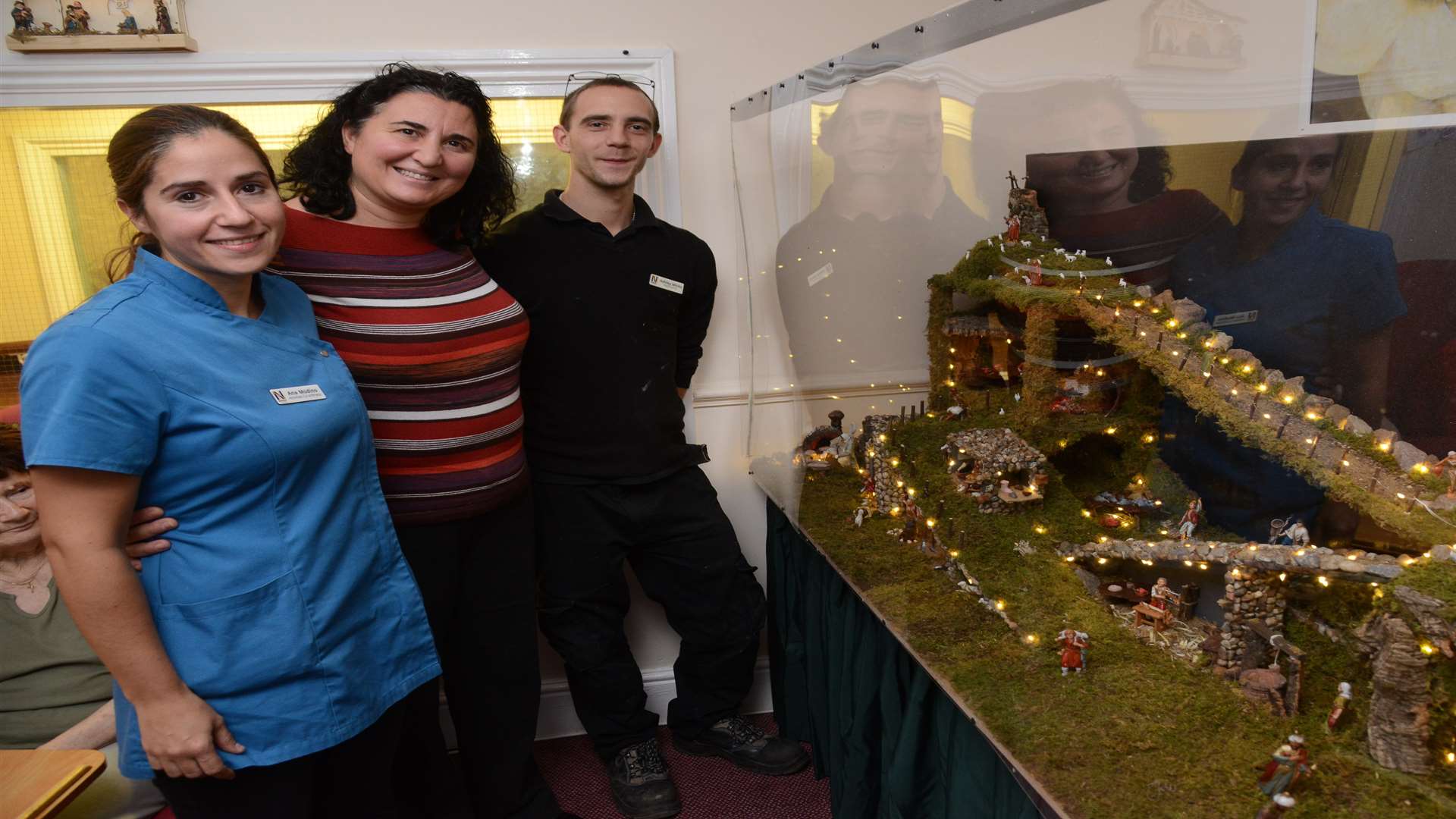 Ana Modino - Activities coordinator Teresa Franze - Manager Ashley Wilks - Maintenance With the nativity model Celebrating an Outstanding CQC report Lulworth House Residential Home Picture: Gary Browne FM5015183
