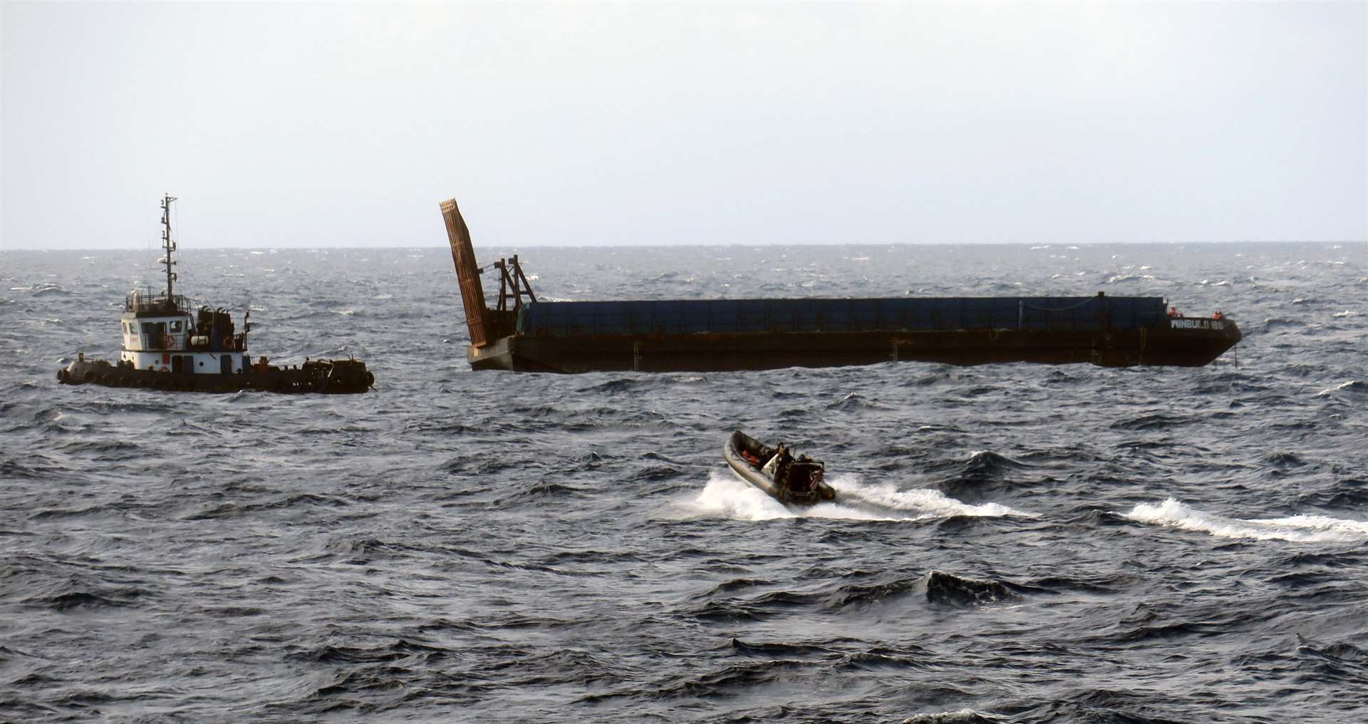 HMS Medway's sea boat heads towards the stricken tug and barge. Photo: Royal Navy