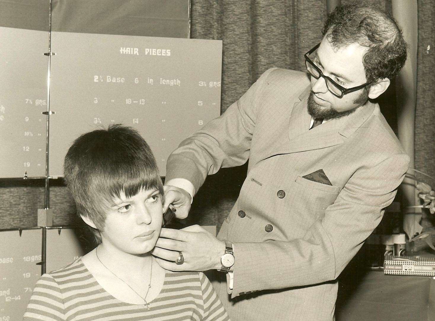 George Antoniou - pictured cutting hair in the 1970s - opened the salon in Whitstable in 1984.