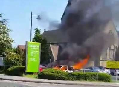 The car caught fire in the car park of supermarket Budgens. Picture: From video by Octane Hairdressing For Men