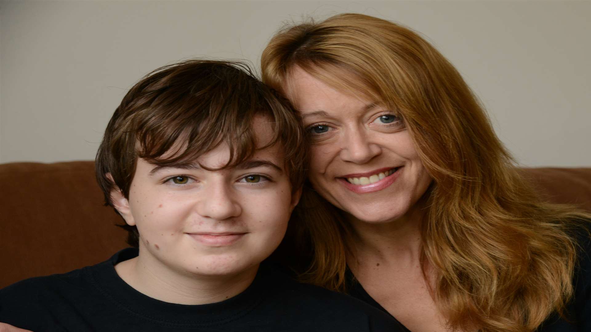 Cameron Norman,13, with his mum Andrea Jacobs. Picture: Gary Browne