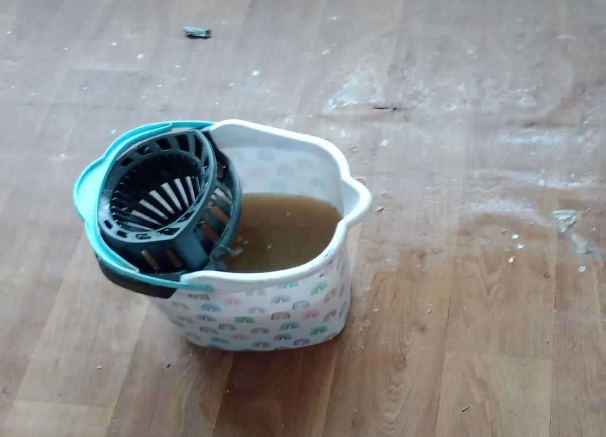 Mop bucket being used to catch water from the leak. Picture: Stacey Sells