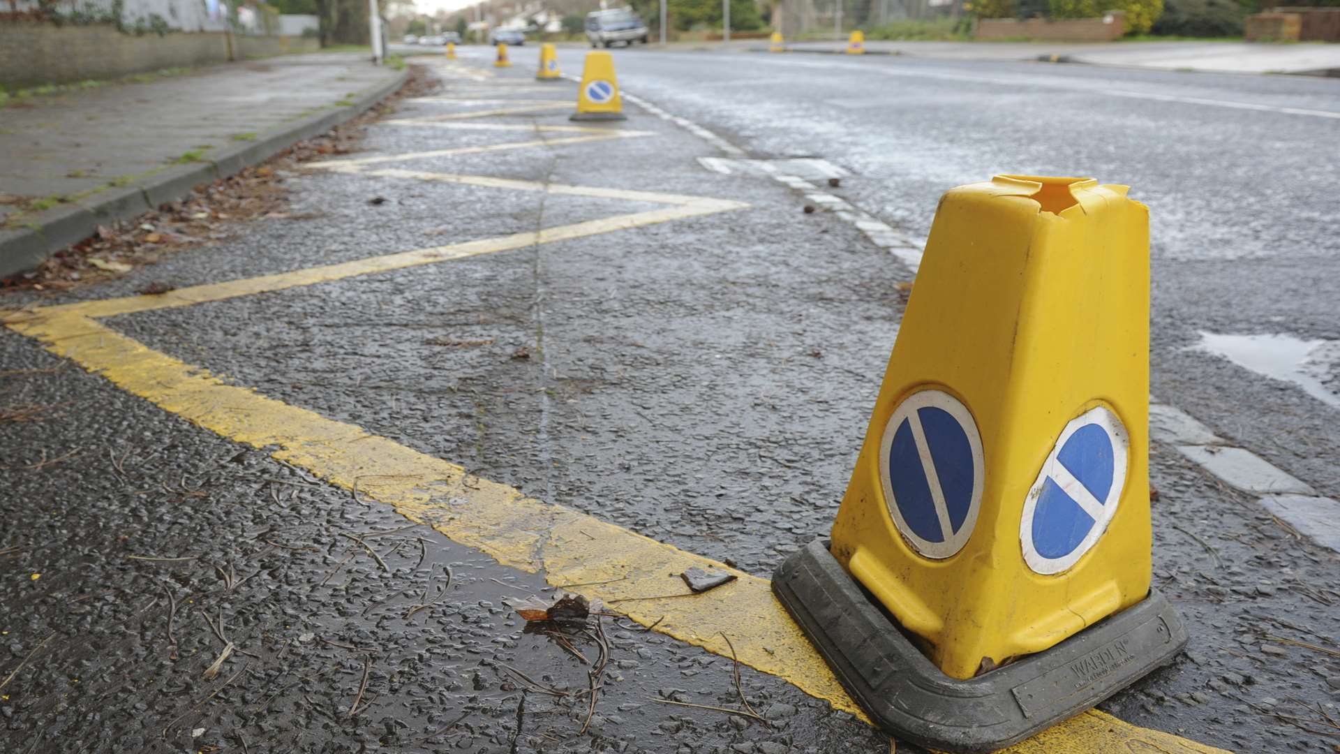 Zig Zag lines and cones near a school. Stock image